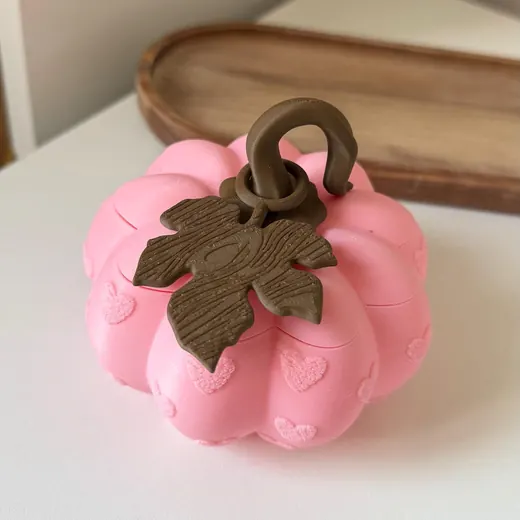 Pink pumpkin box with a brown leaf on top